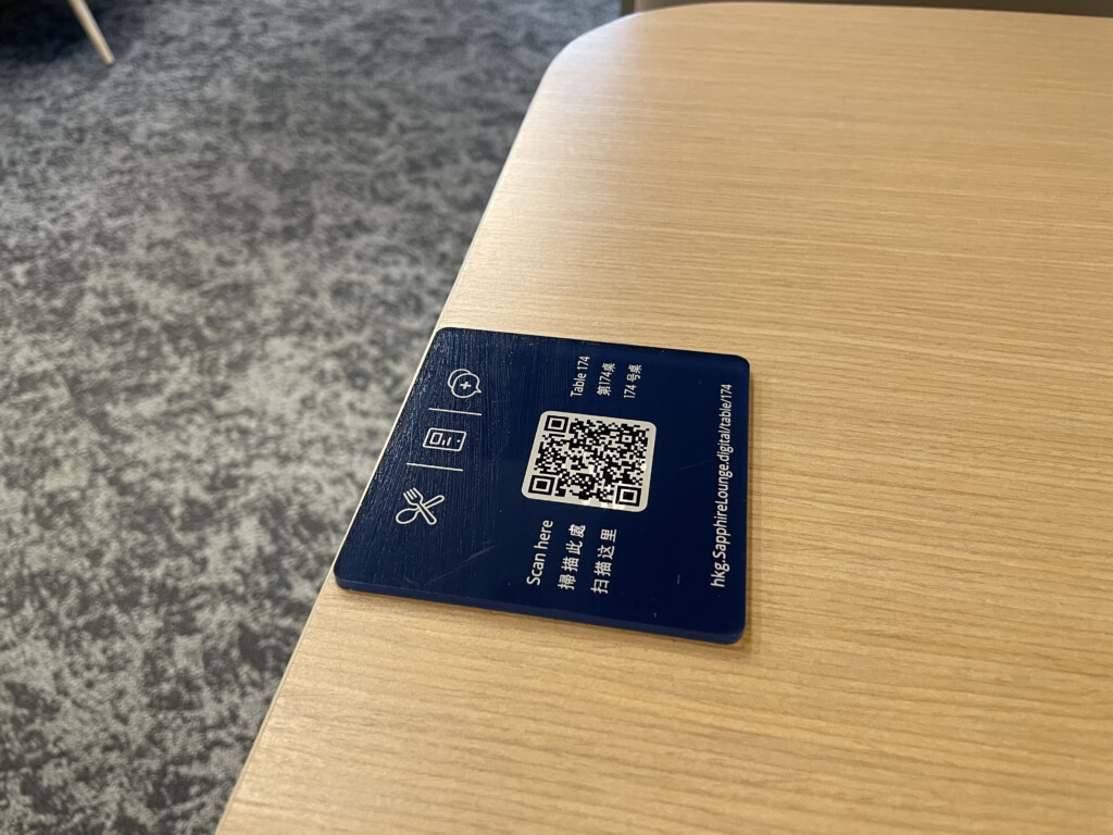 a blue square with white text on a wooden surface