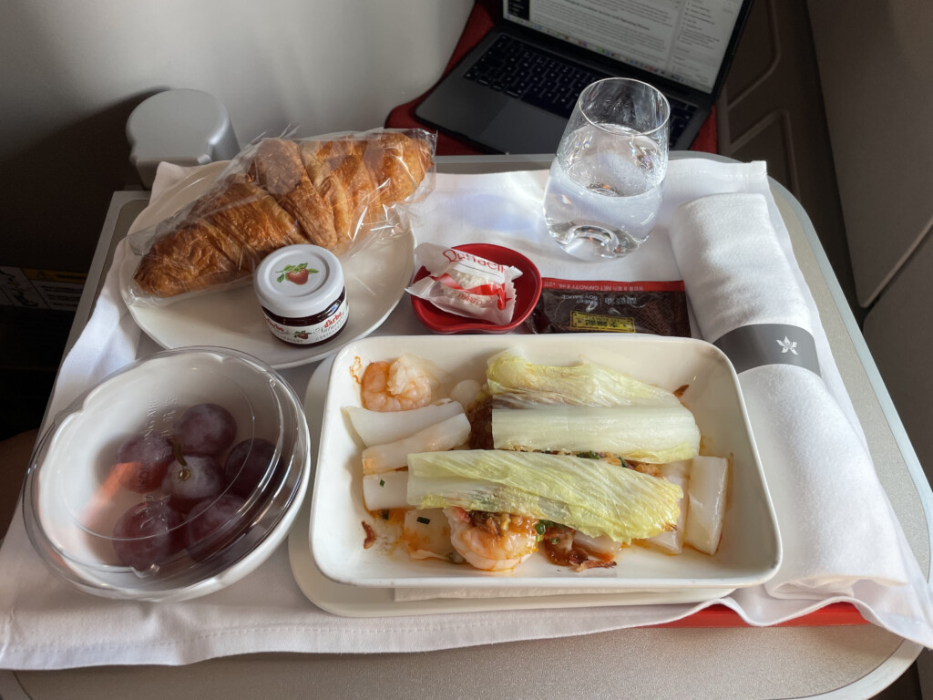 food on a tray with a laptop