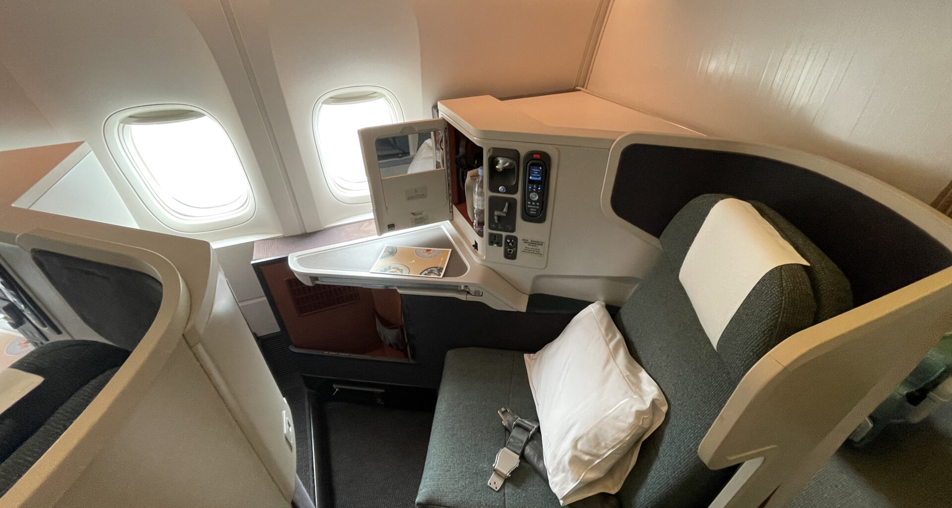 a seat and a table in a plane