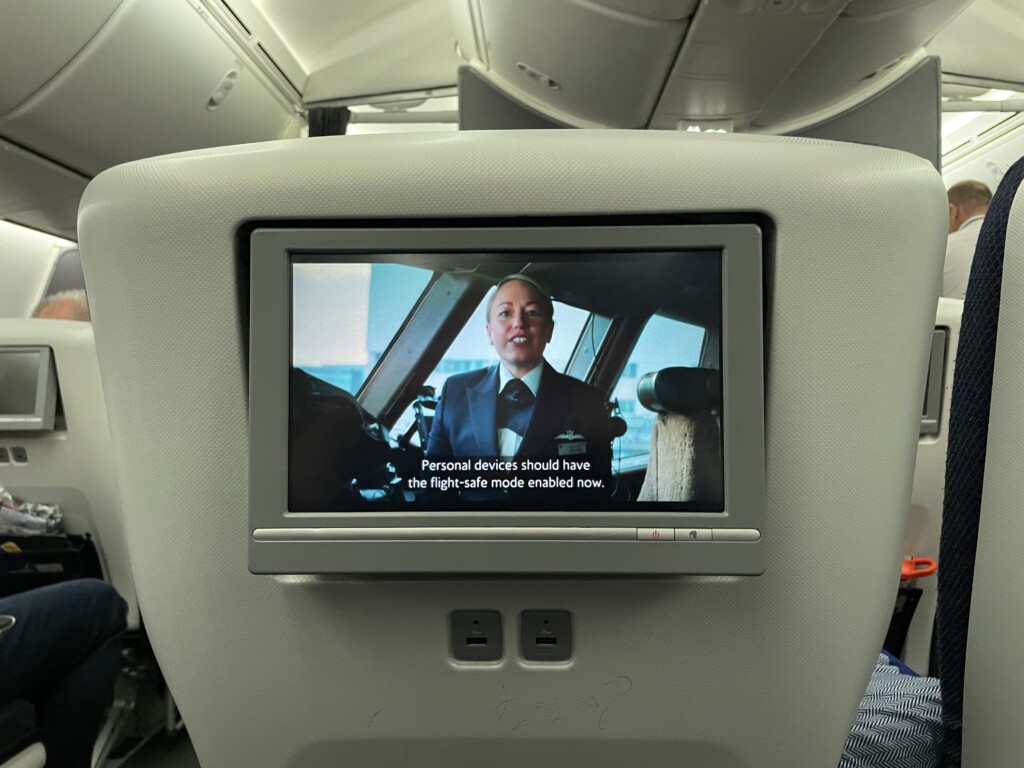 a screen on the back of a plane