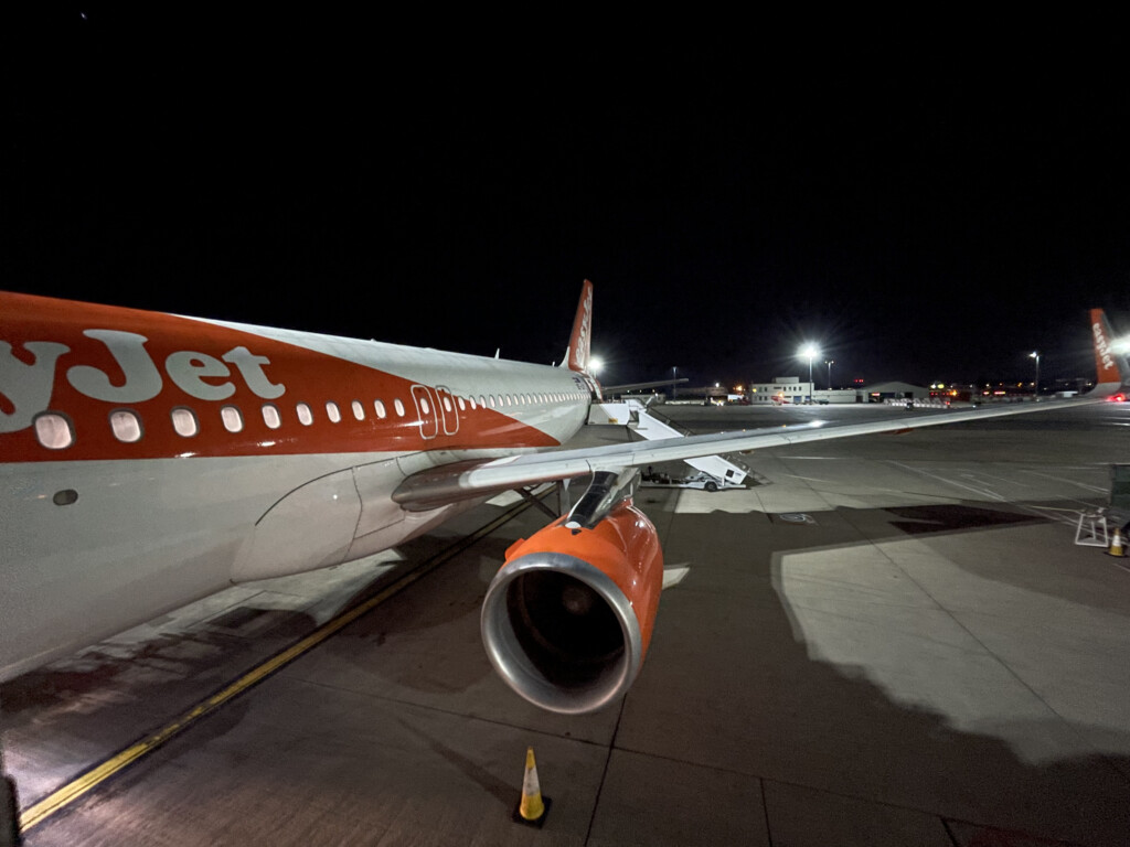 an airplane on the runway at night