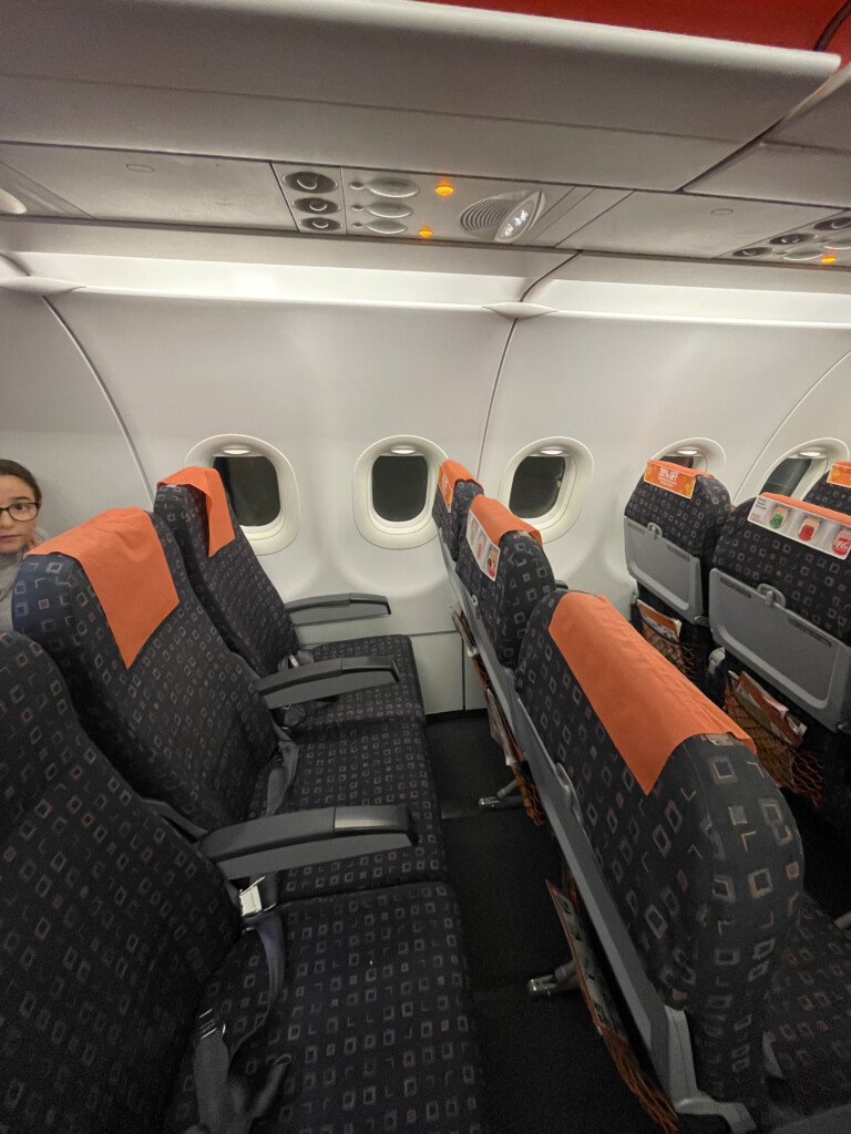 a woman sitting in an airplane