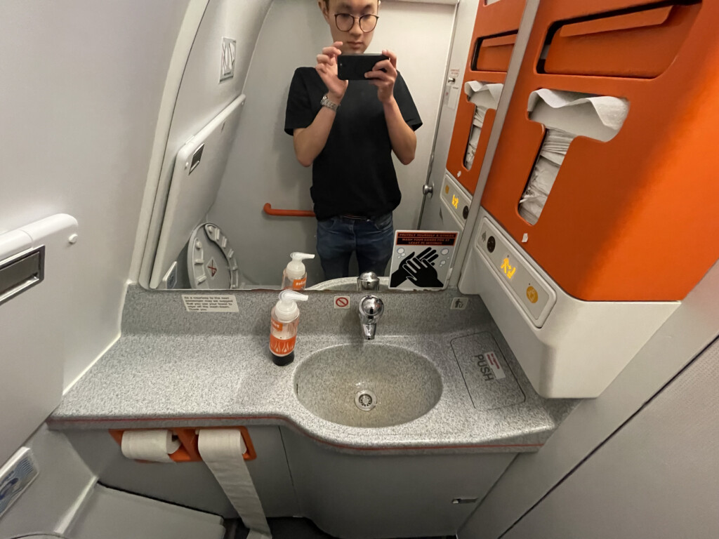 a man taking a selfie in a bathroom