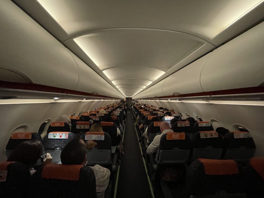 a group of people sitting in an airplane