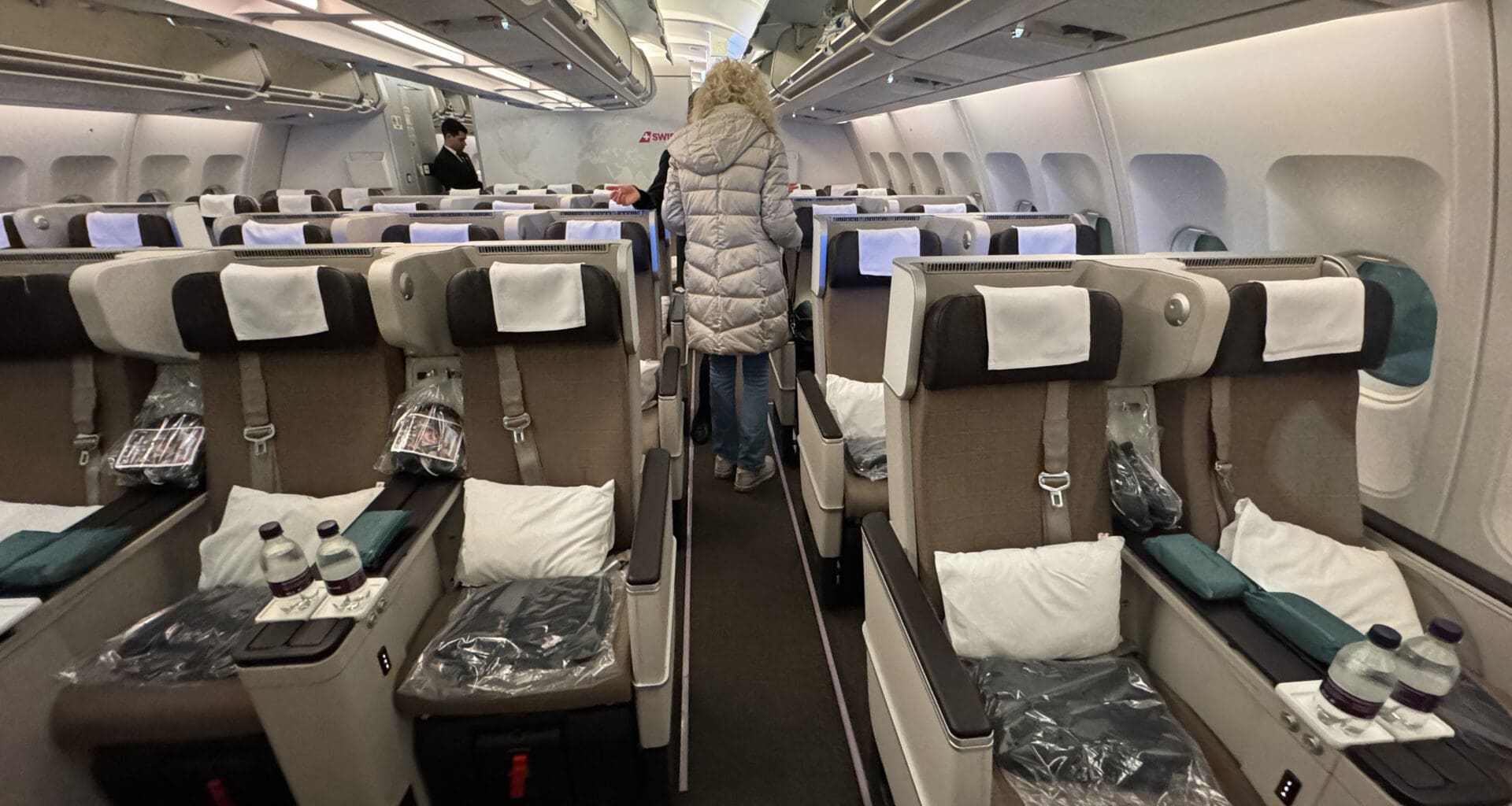 a woman walking in an airplane