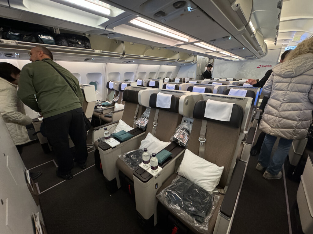 a group of people standing in an airplane