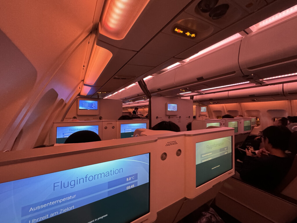 a group of people sitting in an airplane