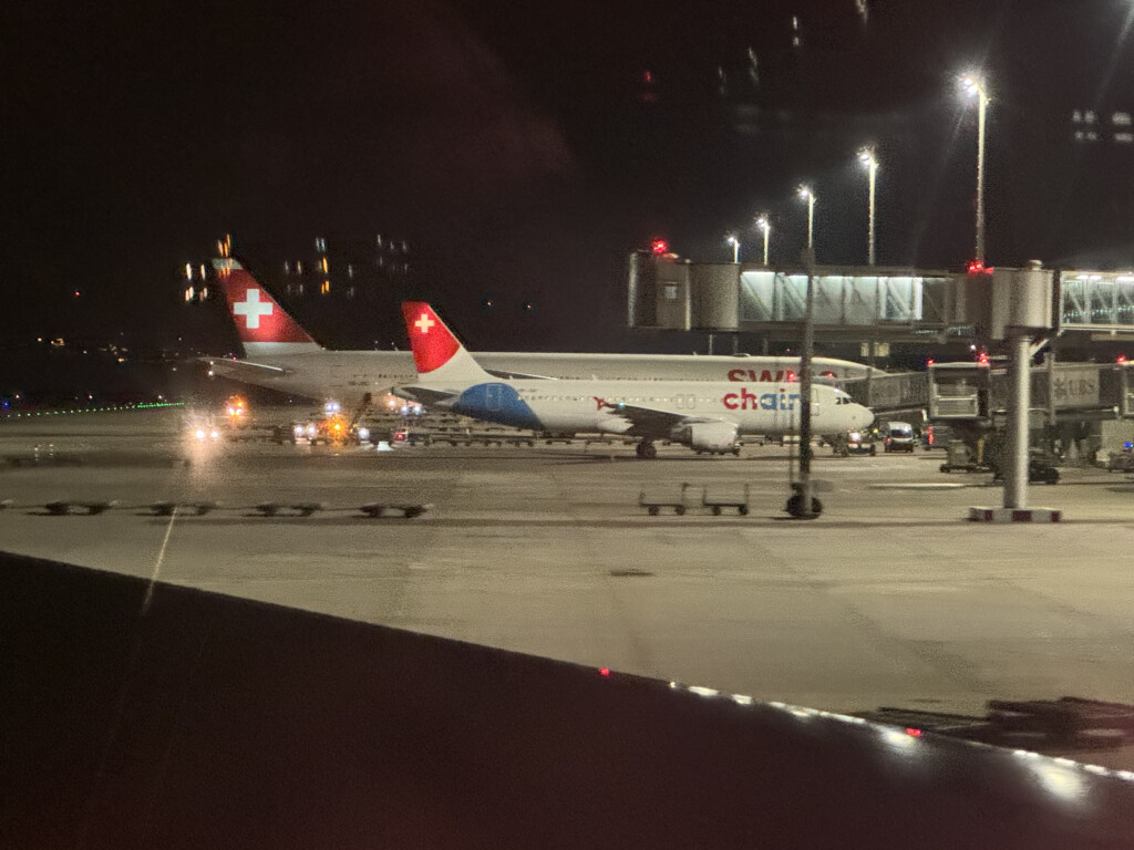 airplanes at an airport at night