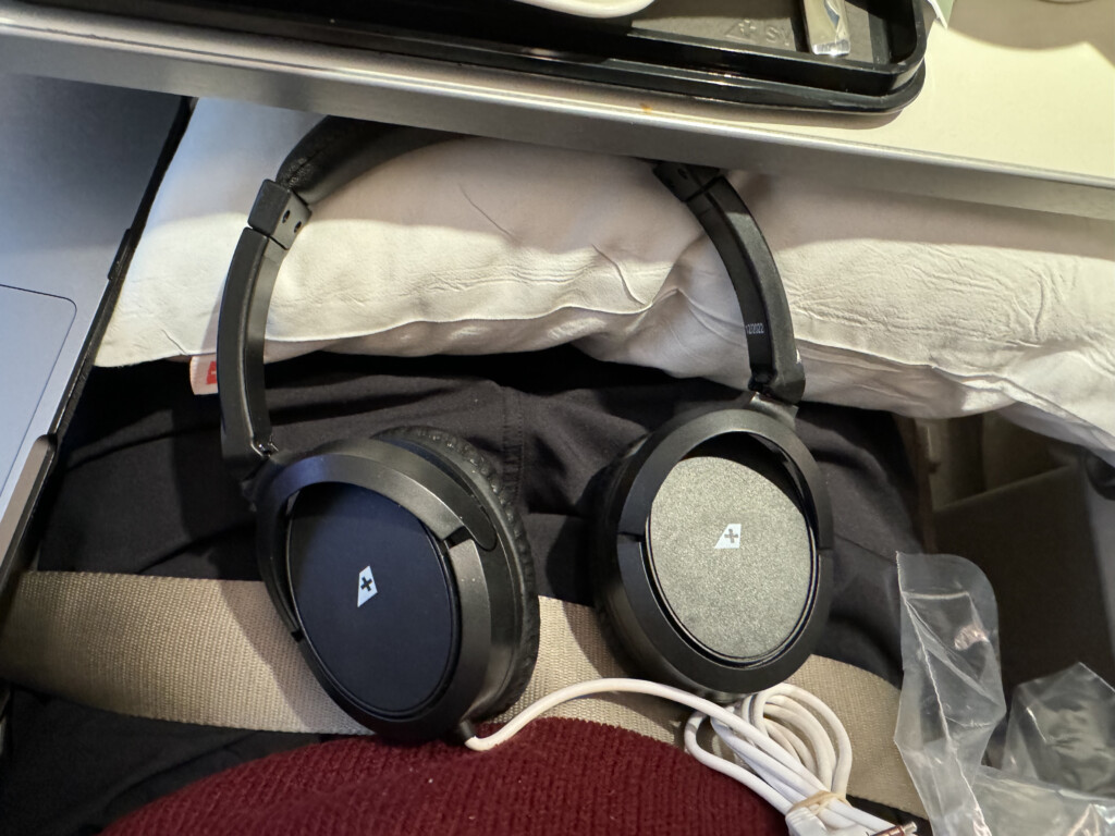 a pair of headphones on a pillow