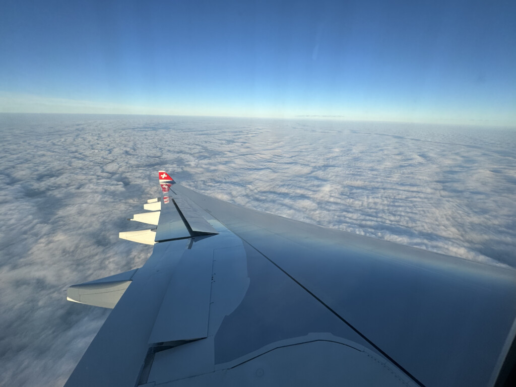 an airplane wing in the sky