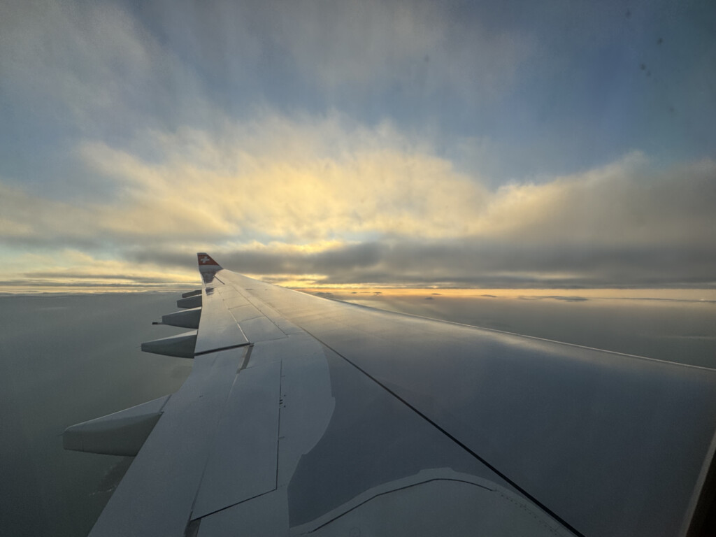 an airplane wing in the sky