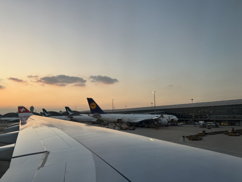 an airplane wing with airplanes in the background