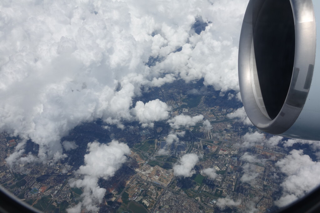 an aerial view of a city and clouds