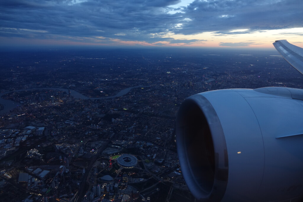 an airplane wing and a city