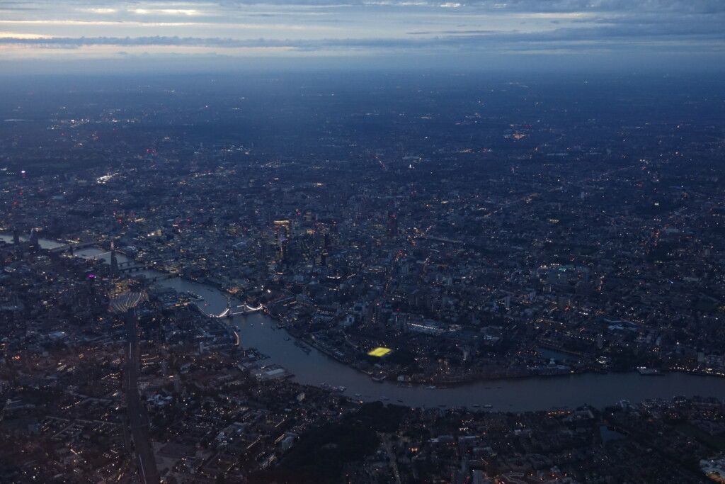 a city with lights and a river