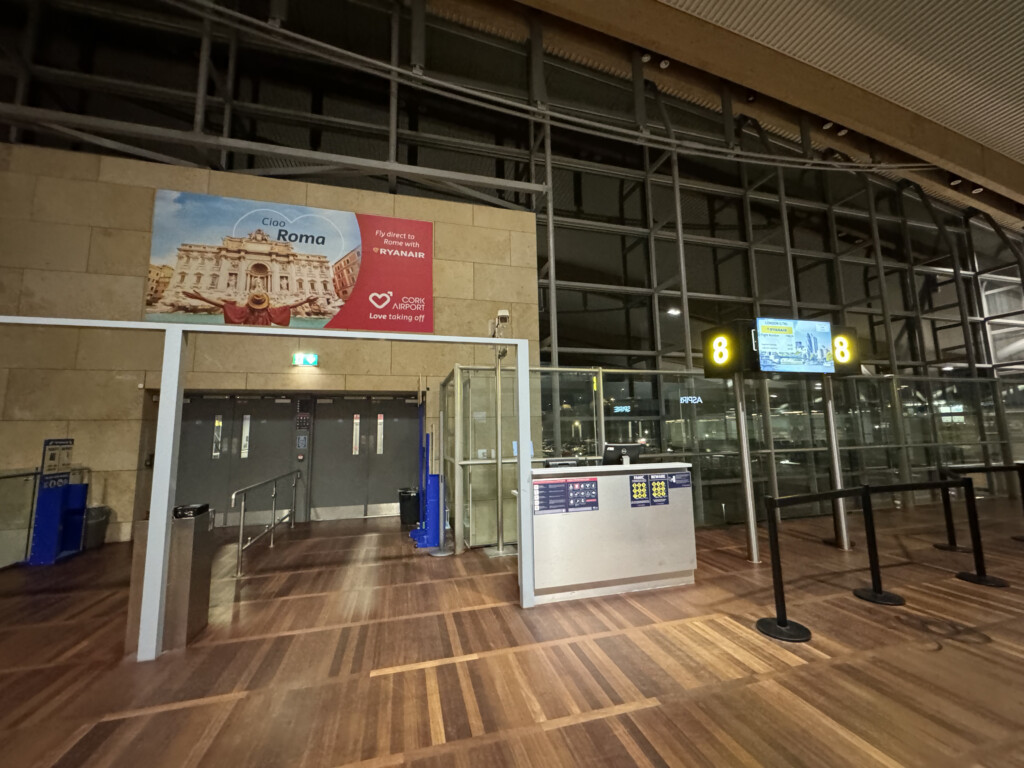 a building with a sign and a gate