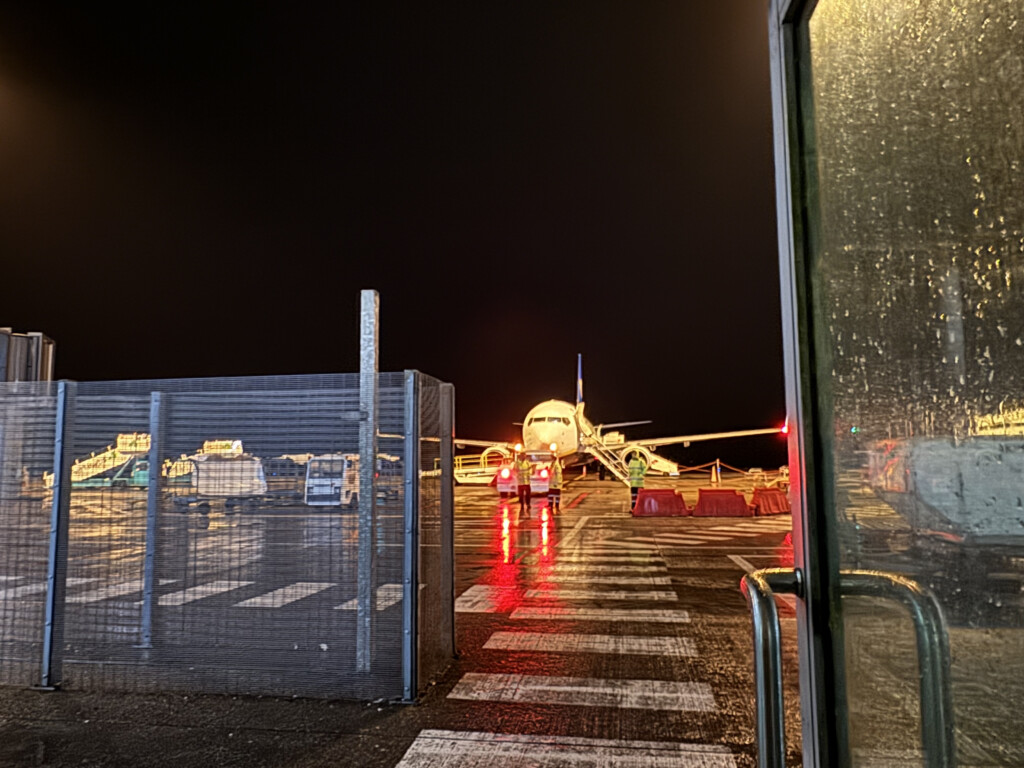 an airplane on a runway at night