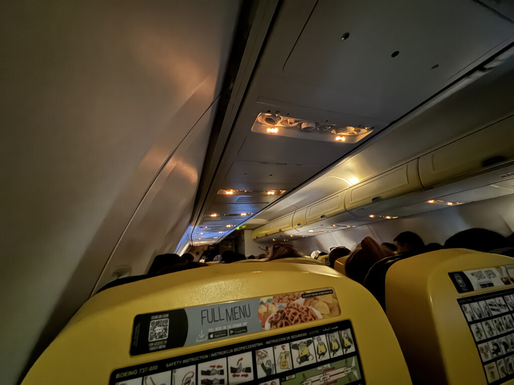 a group of people sitting on an airplane