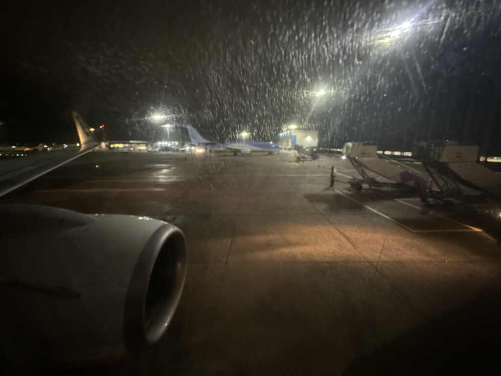 a jet engine and airplane engines on a runway at night