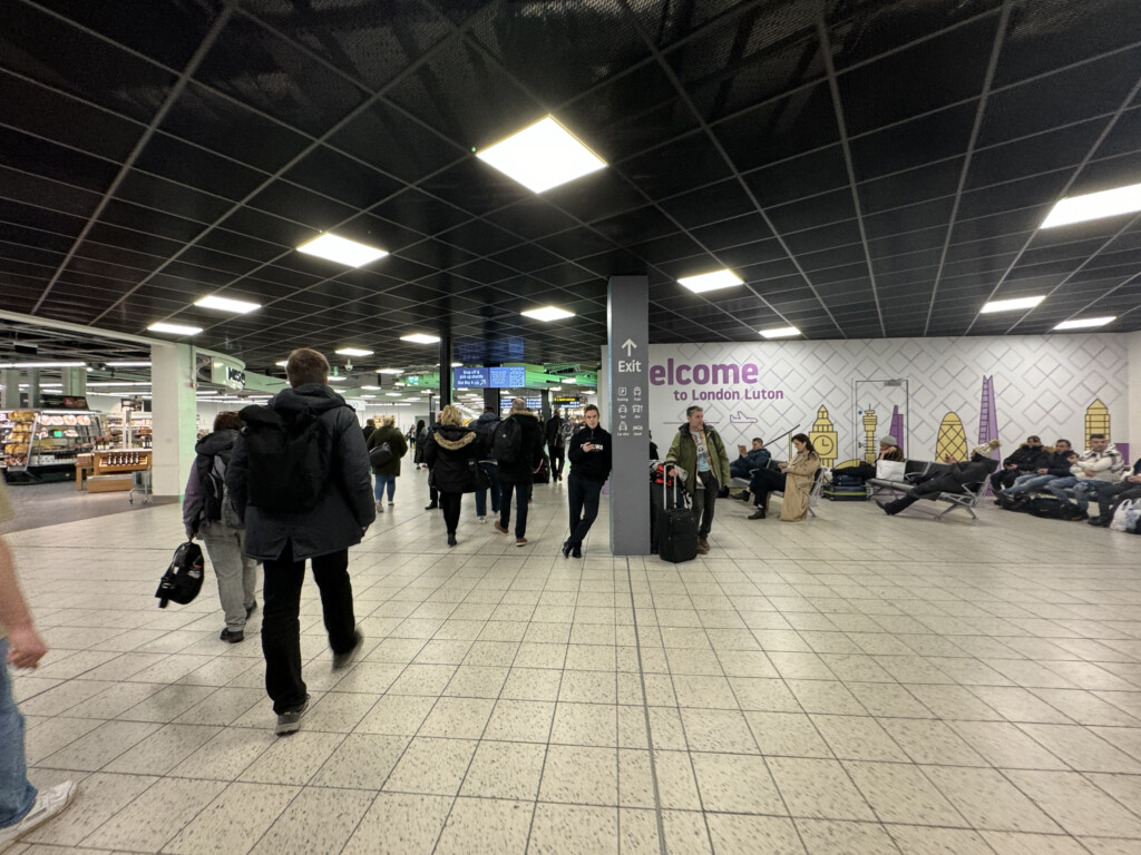 a group of people walking in a large airport