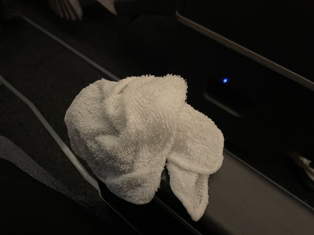 a white towel on a black surface