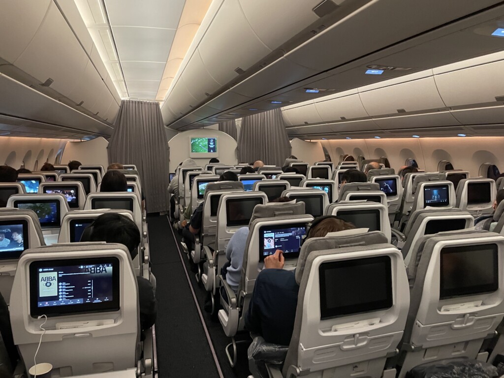 a group of people sitting in an airplane