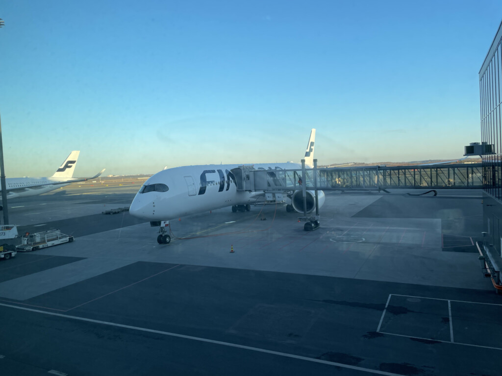 a large white airplane on a tarmac