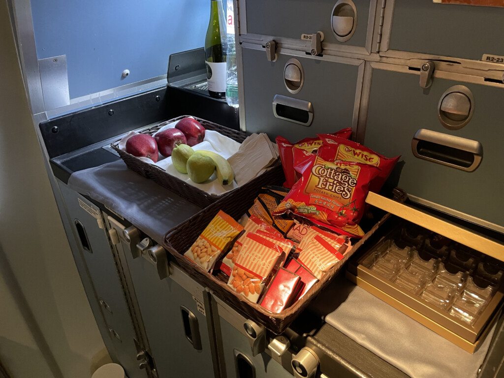 a tray of fruit and snacks on a table