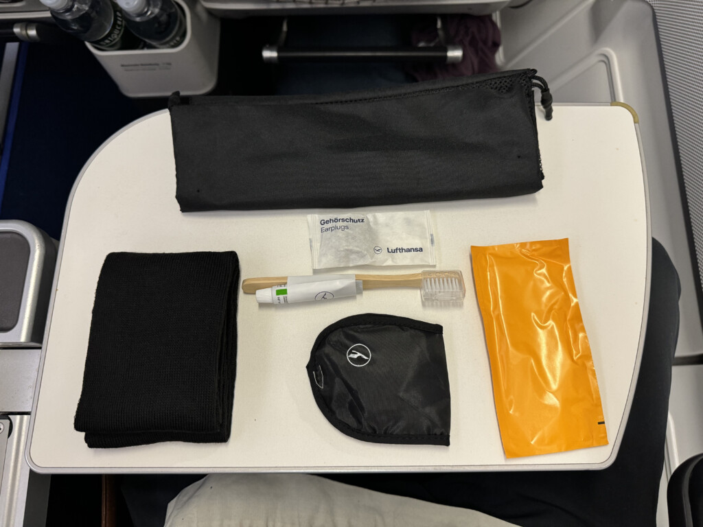 a table with a bag and a toothbrush on it