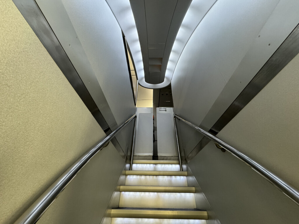 a staircase with a metal railing