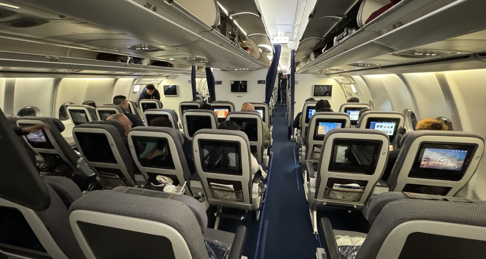 a group of people sitting in an airplane