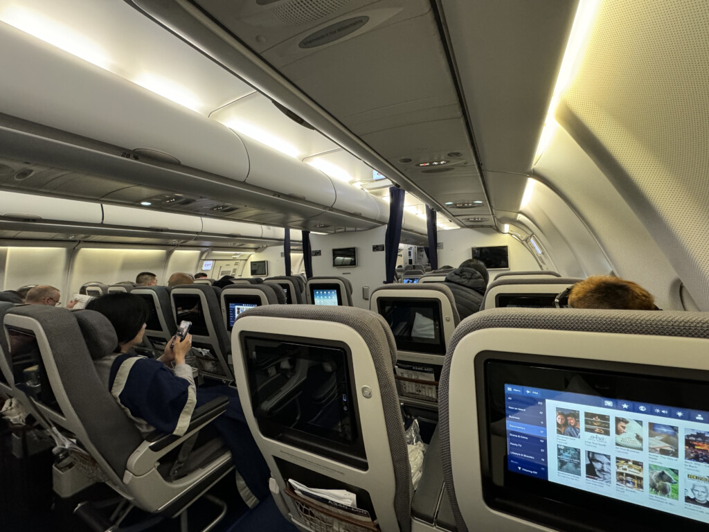 a group of people sitting in an airplane