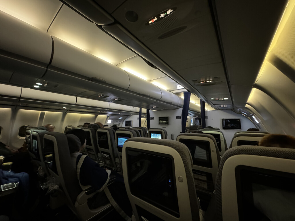 a group of people sitting in an airplane