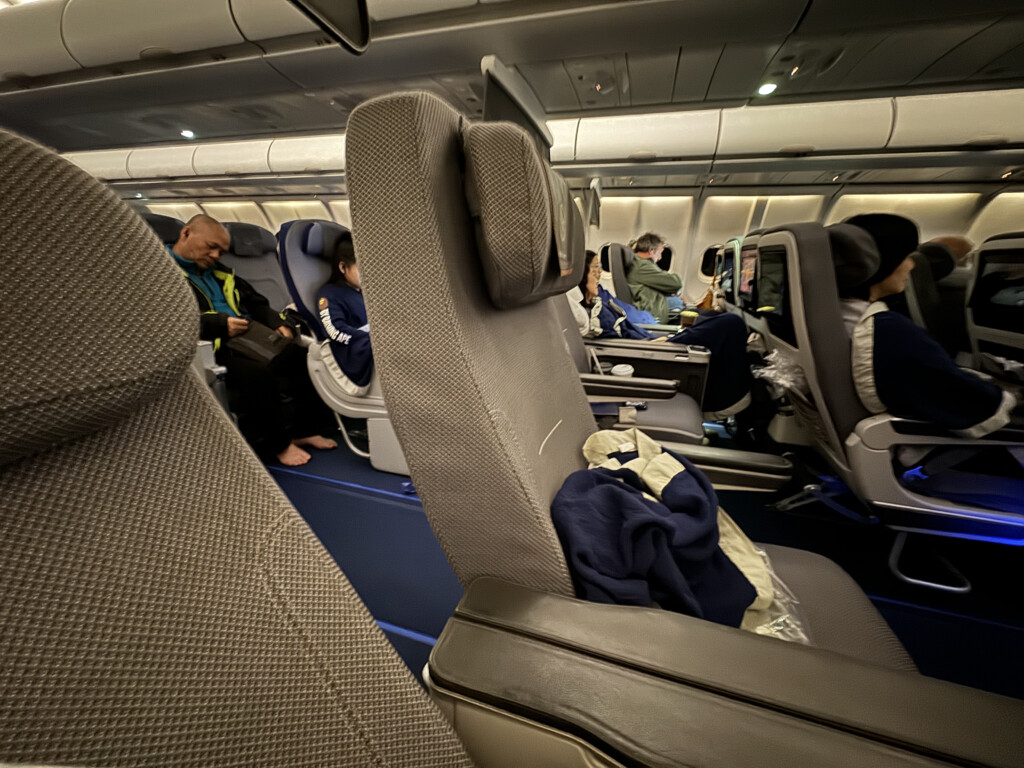 a group of people sitting in an airplane