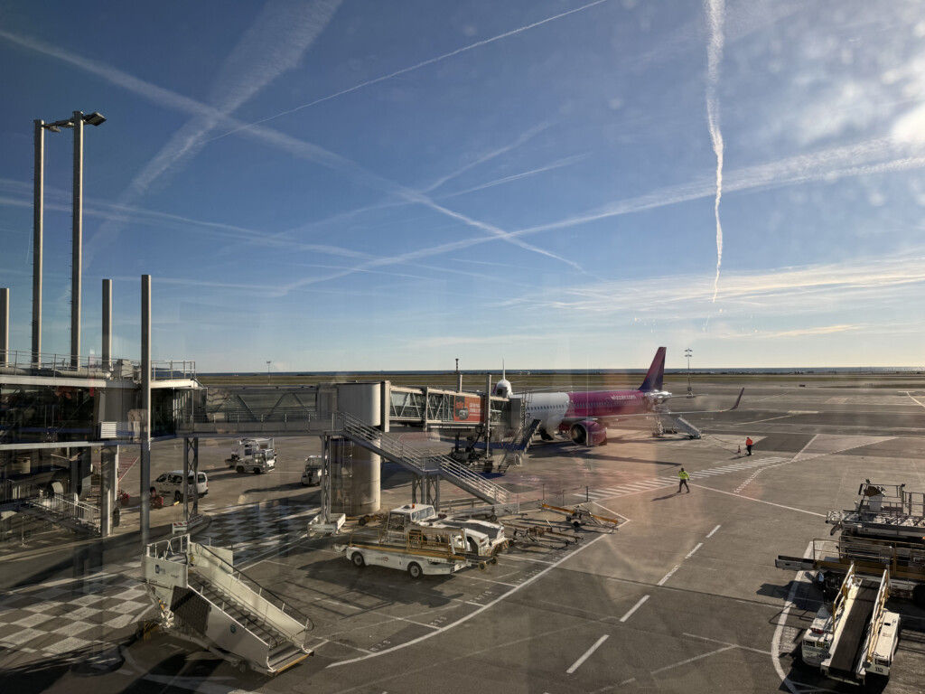 an airport with airplanes and a ramp