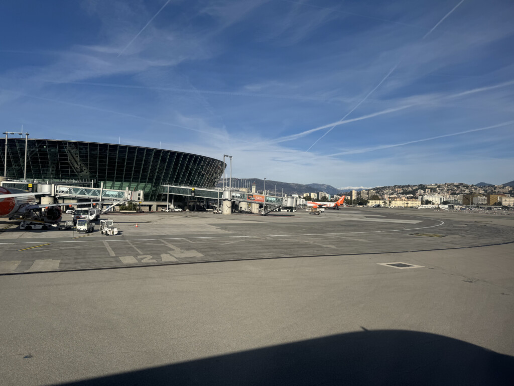 a large stadium with planes in the background