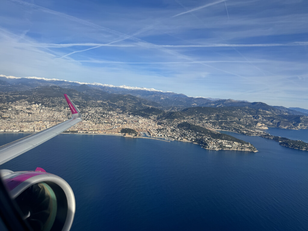 an airplane wing over a body of water