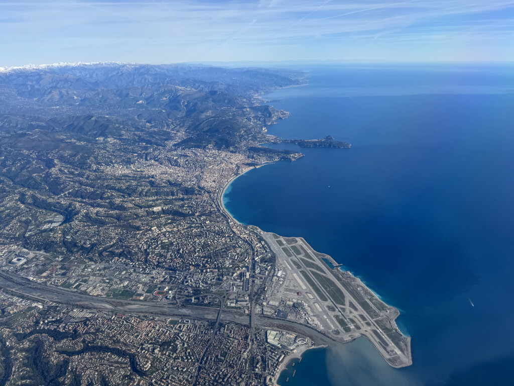 an aerial view of a city and a body of water