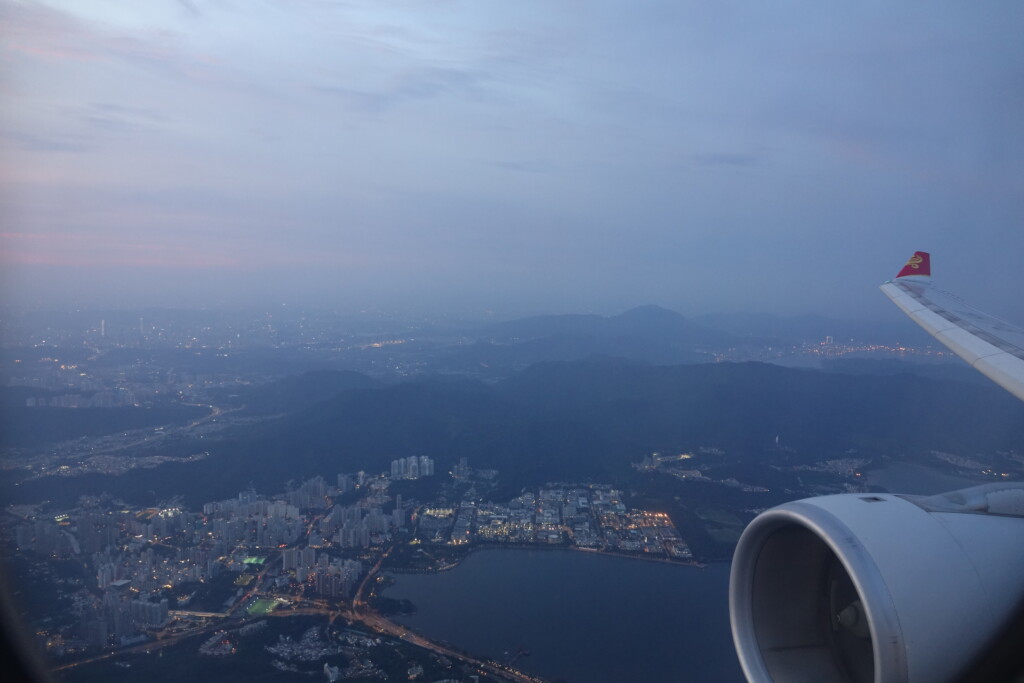 an aerial view of a city and a body of water