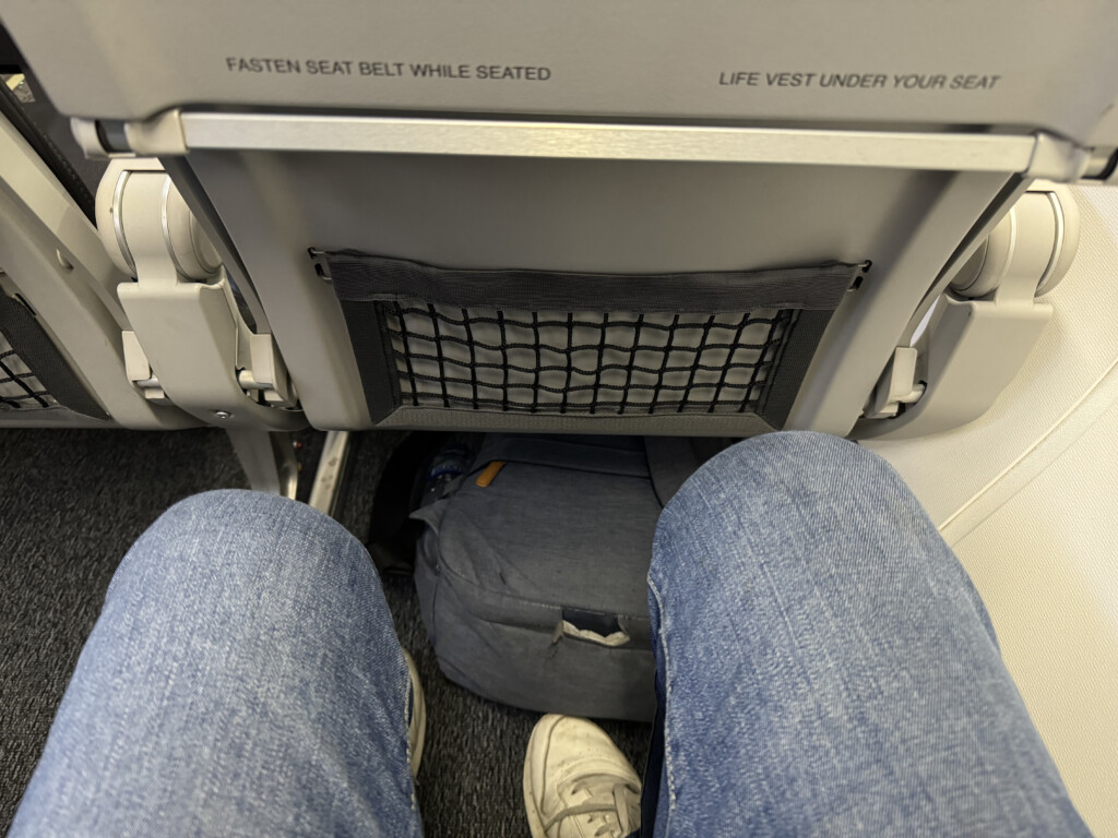 a person's legs in a seat