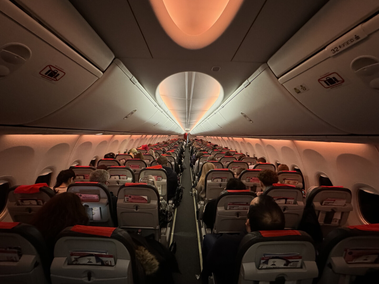 a group of people sitting in an airplane