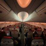 a group of people sitting in an airplane