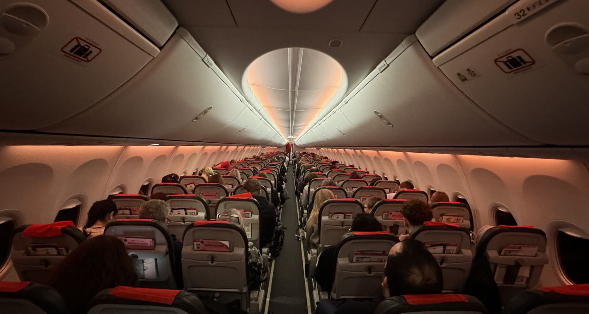 a group of people sitting in an airplane