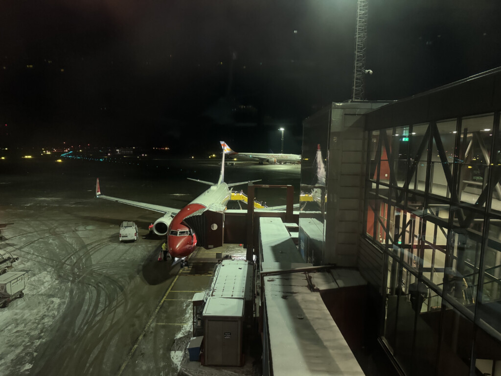 a plane on the runway at night