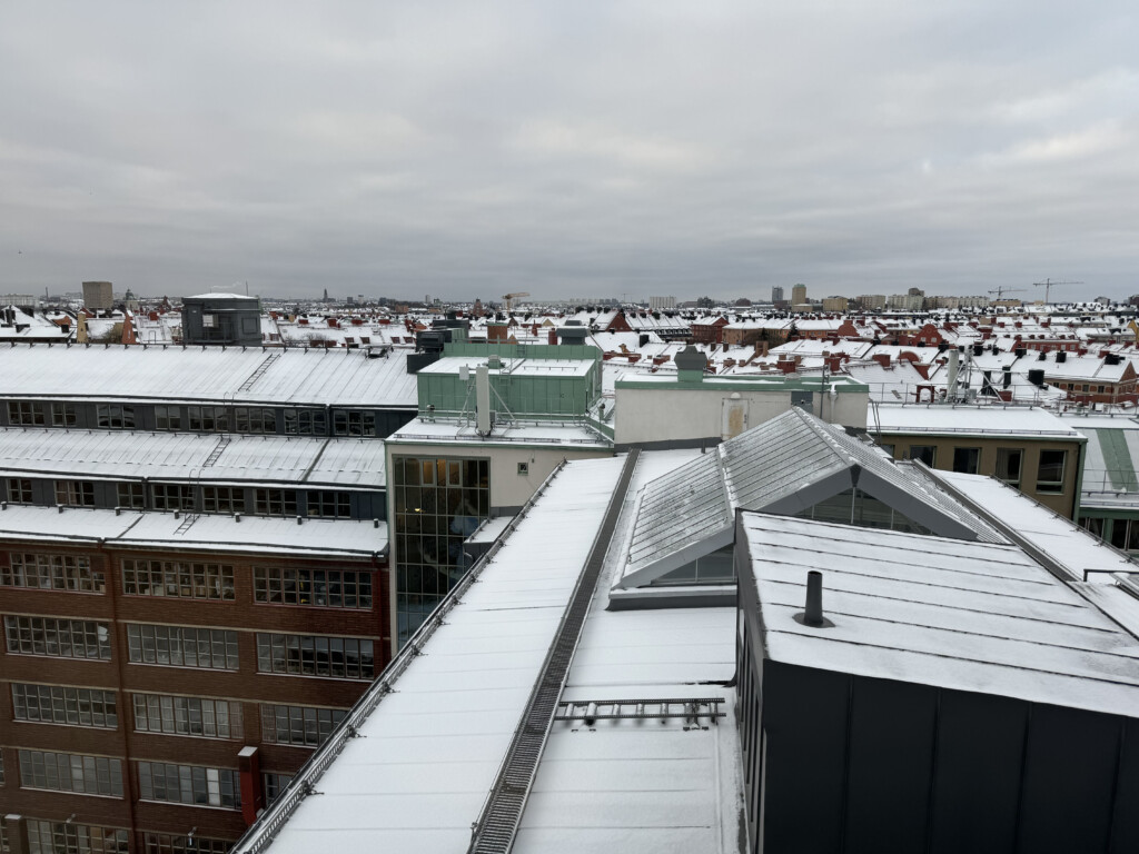 a rooftops of a city with snow