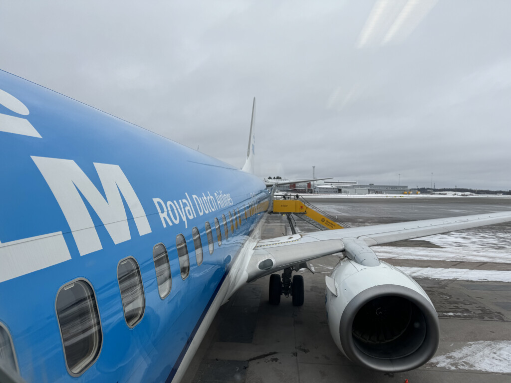 a blue airplane with white text on it