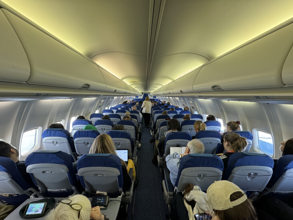 a group of people sitting in an airplane