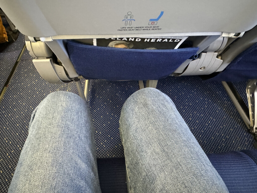 a person's feet in grey socks on a seat