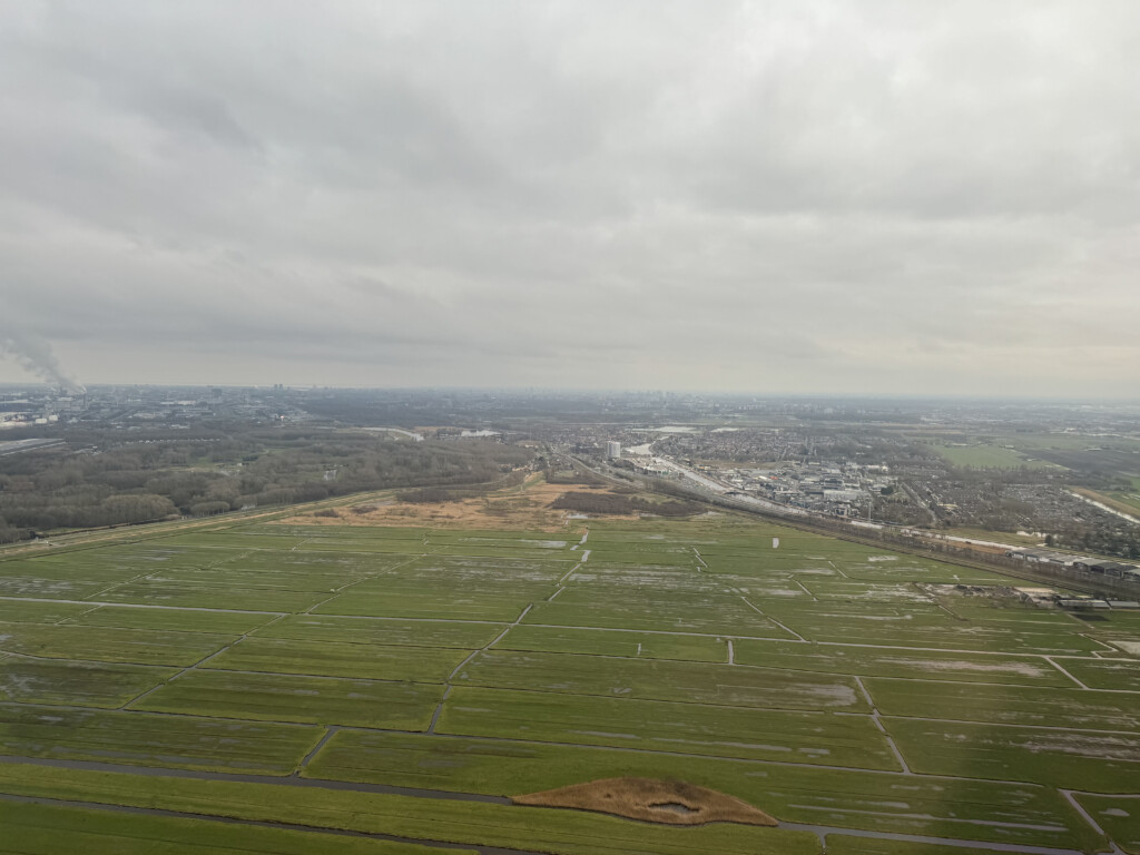 a aerial view of a large green field