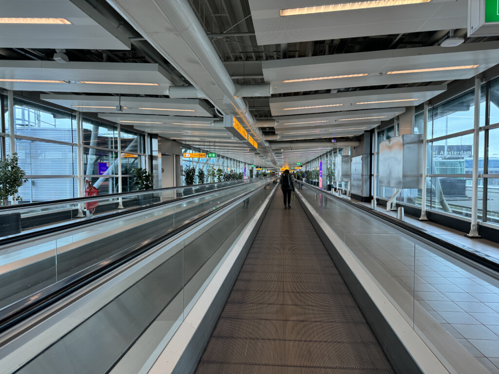 a person walking on an escalator